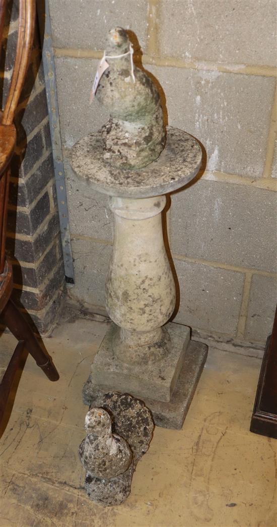 A reconstituted stone dove on a plinth together with one other, width 23cm, height 83cm